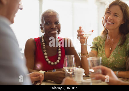 Mature friends dining at restaurant Stock Photo