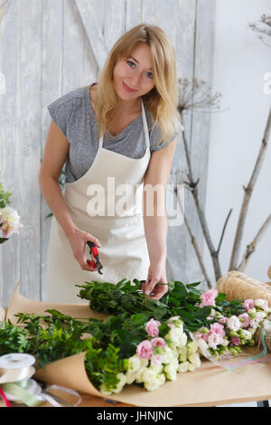 Image of smiling florist girl Stock Photo