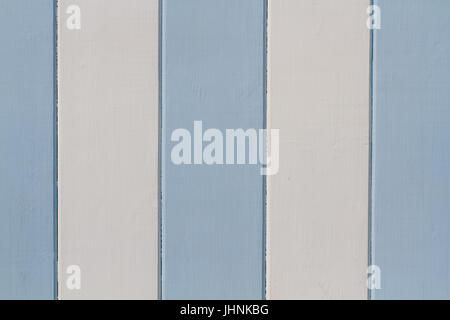 Vertical light blue and white striped planks or boards of wood in a seaside or nautical background image. Stock Photo