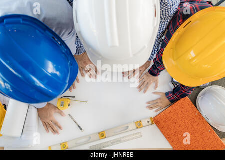 Group of young engineers or architects working in the office. engineers or architects meeting and planning project. Top view Stock Photo