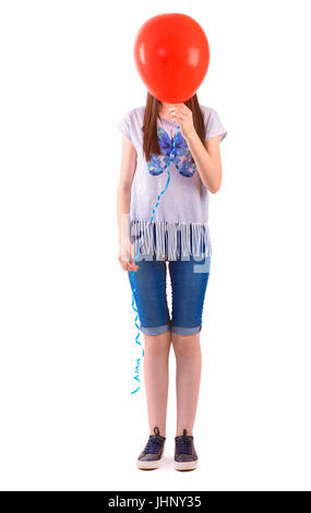 Teenager girl with balloon cover her face on white background. Stock Photo