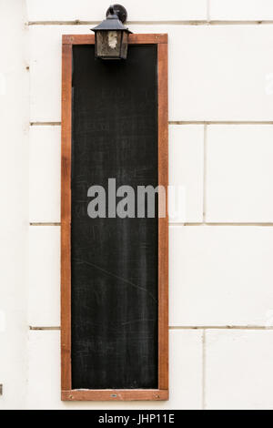 Blank Board menu, rectangular stand mock up, on the terrace of the restaurant, outdoors on the sidewalk. Stock Photo