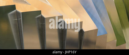 Colorful light reflections on silver grey metallic surface with fine texture. Stock Photo