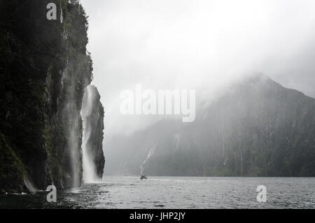 Boat Cruise Through Milford Sound, New Zealand Stock Photo