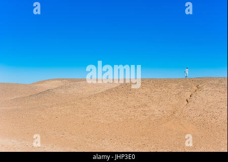 Man walk in the small village near Merzouga, Morocco Stock Photo