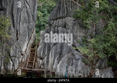 blur in philippines view from a boat of  palm cliff beach and rock from pacific ocean Stock Photo