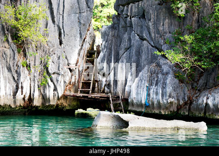 blur in philippines view from a boat of  palm cliff beach and rock from pacific ocean Stock Photo