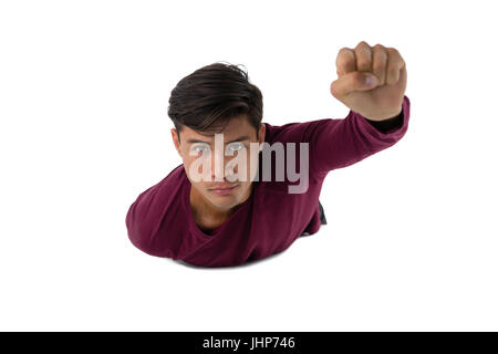 Portrait of businessman imitating as super heroes against white background Stock Photo