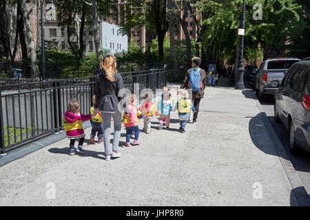 Children walk to school on rope hi-res stock photography and