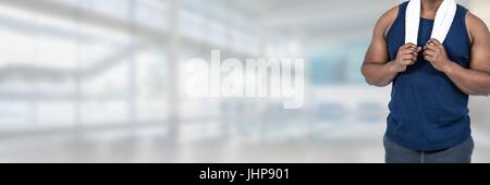 Digital composite of Strong healthy man holding towel in gym Stock Photo
