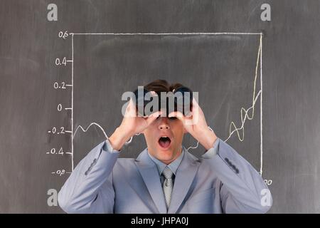 Digital composite of Surprised man looking through binoculars against background with infographics Stock Photo