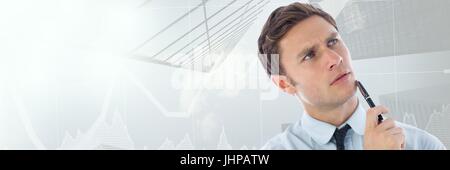 Digital composite of Thinking man with sky scrapers and arrows of stock market transition Stock Photo