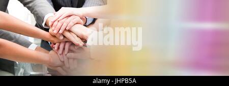 Digital composite of Business team putting hands together and blurry sticky note transition Stock Photo