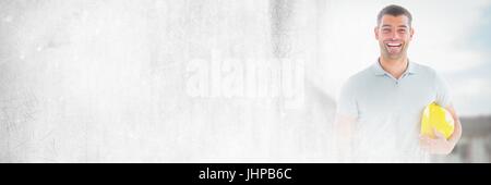 Digital composite of Construction Worker in front of construction site with transition effect Stock Photo