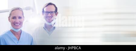 Digital composite of Two dentists smiling and blurry white transition Stock Photo