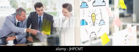 Digital composite of Businesspeople collaborating in office wide shot Stock Photo