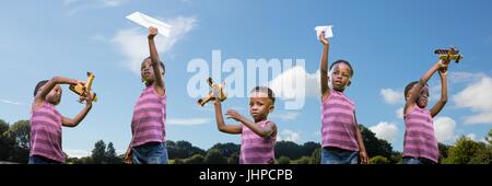 Digital composite of Boy playing with a plane collage against sky background Stock Photo