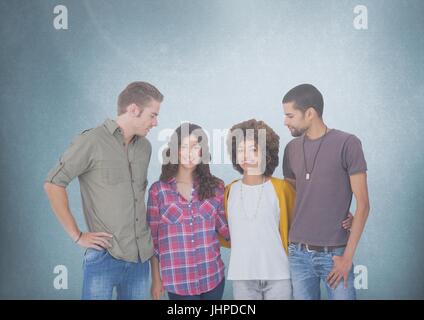 Digital composite of Group of people standing in front of blank blue background Stock Photo