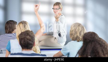 Digital composite of Students with teacher in front of blurred background Stock Photo