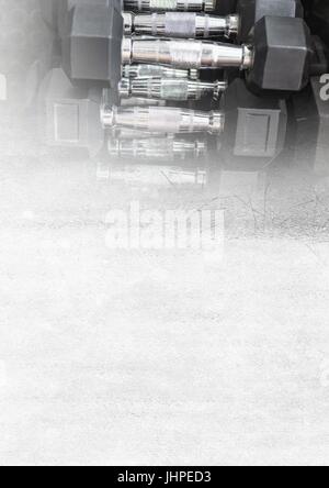 Digital composite of Dumbbells in Gym with transition Stock Photo