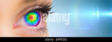 Digital composite of Close up of eye with rainbow iris and blue smart tech transition Stock Photo