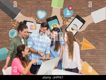 Digital composite of Happy business people at a desk looking at a computer against brick wall with graphics Stock Photo