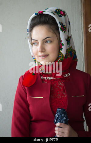 Beautiful young woman witht raditional headscarf, village of Breb, district of Maramures, Romania Stock Photo