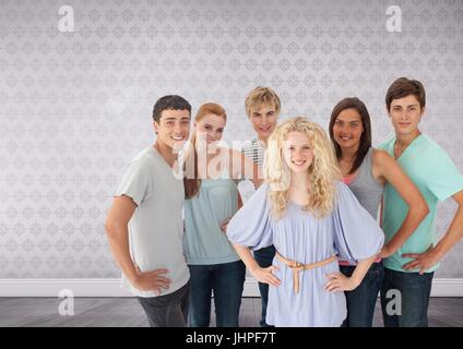 Digital composite of Group of young adults standing in front of bright wallpaper background Stock Photo