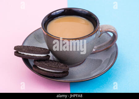 Cup of coffee with milk on pastel background. Studio Photo Stock Photo