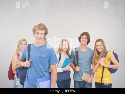 Digital composite of Group of students standing in front of blank grey background Stock Photo