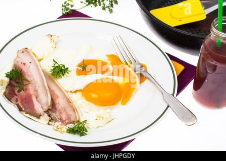 Hearty breakfast with bacon and fried eggs. Studio Photo Stock Photo