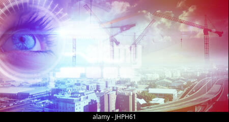 Blue eye looking up on female face against overhead view of architect material Stock Photo