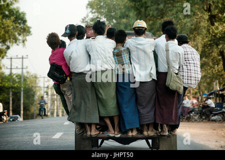 Overcrowded pickup truck on a highway in Yangon.  February 23, 2014 - Rangoon, Myanmar Stock Photo