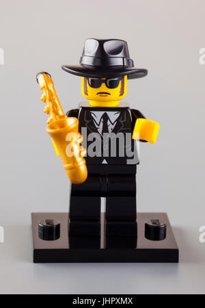Tambov, Russian Federation - September 11, 2013 Lego Jazz Musician minifigure with saxophone on gray background. Studio shot. Stock Photo