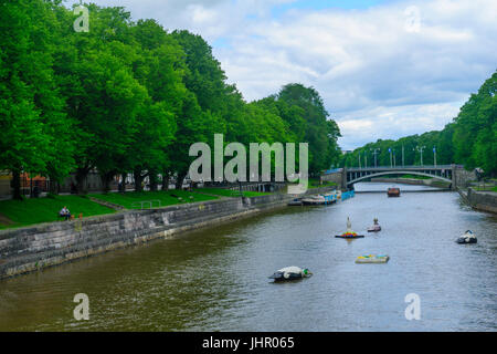 TURKU, FINLAND - JUNE 23, 2017: View of the Aura river, with locals and visitors, in Turku, Finland Stock Photo