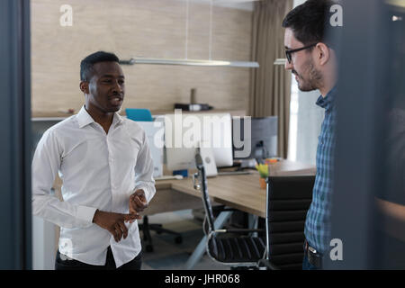 Two businessmen team discussing in the office Stock Photo
