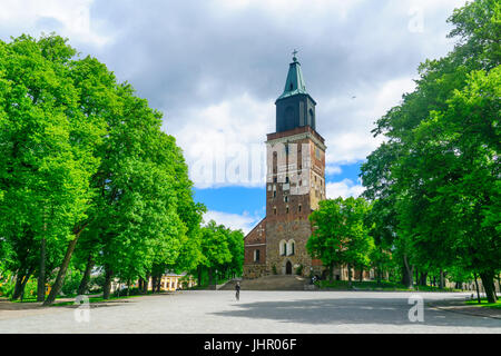 TURKU, FINLAND - JUNE 23, 2017: View of the Cathedral, with a cyclist, in Turku, Finland Stock Photo