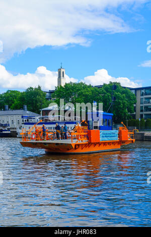 TURKU, FINLAND - JUNE 23, 2017: Scene of the Aura river, with the Fori ferry and passengers, in Turku, Finland Stock Photo