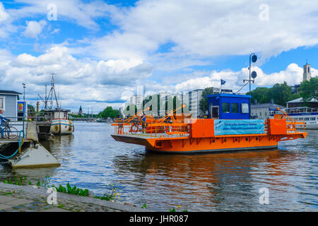 TURKU, FINLAND - JUNE 23, 2017: Scene of the Aura river, with the Fori ferry and passengers, in Turku, Finland Stock Photo