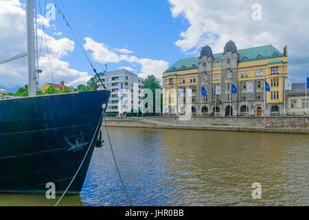 TURKU, FINLAND - JUNE 23, 2017: View of the City hall and the Aura river, with locals and visitors, in Turku, Finland Stock Photo