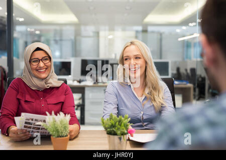 Business meeting in a modern office, multiracional colleagues collaborating together. Stock Photo
