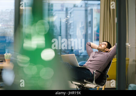 businessman sitting on a chair and thinking strategies Stock Photo