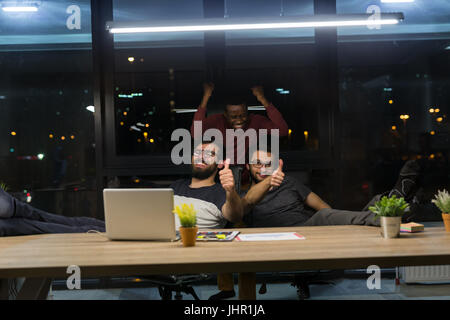 man enjoying camp fire in winter Stock Photo