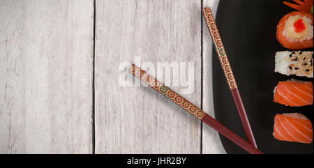 Close up of food in plate against wood panelling Stock Photo