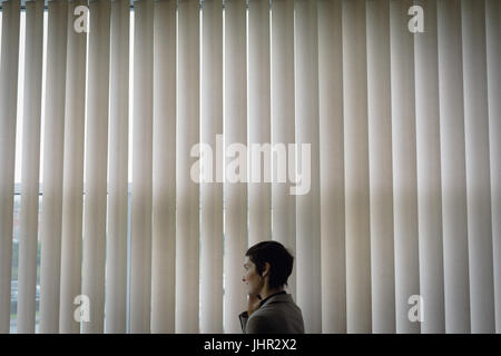 Beautiful businesswoman talking on mobile phone in office Stock Photo