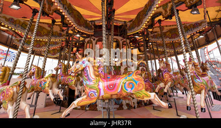 Empty merry-go-round ride in amusement park Stock Photo
