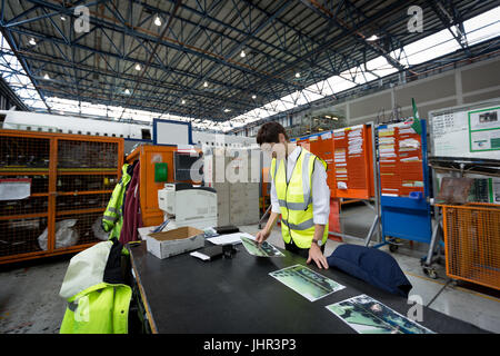 Female aircraft maintenance engineer working at airlines maintenance facility Stock Photo