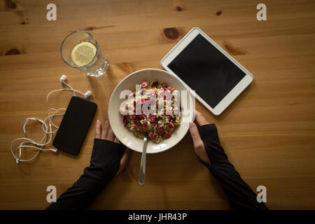 Directly above shot of woman having breakfast at table Stock Photo