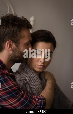 Close up of affectionate young couple in bed at home Stock Photo