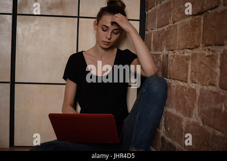 Beautiful woman using laptop at home Stock Photo